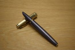 A Parker 100 converter fill fountain pen in Smoke Bronze with a Gold cap
