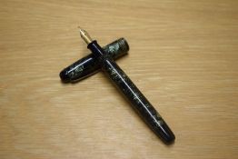 A Parker Televisor Slender button fill fountain pen in lined green with three gold cap bands