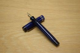 A Parker Duofold Junior button fill fountain pen in Lapis Lazuli Blue with two narrow bands to the