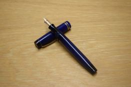 A Parker Duofold Junior Streamlined button fill fountain pen in lapis lazulii with two gold bands to