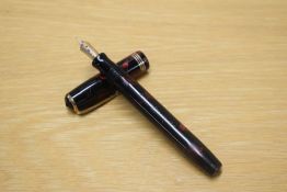A Parker Duofold Premiere button fill fountain pen in Red and Black marble, made in Canada with
