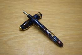 A Conway Stewart Dinkie 550 lever fill fountain pen Le Tigre Baby in Brown and Blue Marble with a