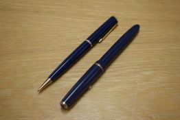 A Parker Slimfold aerometric fill fountain pen and Duofold Propelling pencil in Blue with decorative