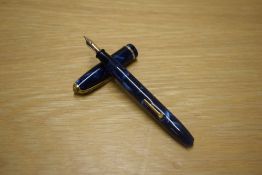 A Conway Stewart Dinkie 550 lever fill fountain pen in Blue Marble with a single cap band having