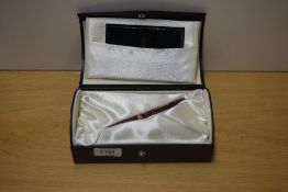 A boxed Conway Stewart 58 Series lever fill fountain pen in Burgundy Blush No 623/010 with one