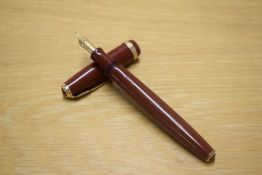 A Parker Duofold button fill fountain pen in Terracotta with wide decorative cap band having