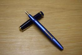 A Conway Stewart 570 lever fill fountain pen in Blue with single wide cap band having Conway 14ct