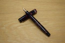 A Parker Duofold Junior button fill fountain pen in Burgundy and Black marble with two narrow cap