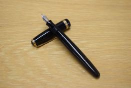 A Parker Vacumatic fountain pen in black with a wide decorative cap band having a Parker 14K nib