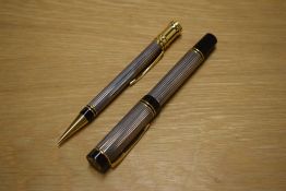A Parker Duofold Centenial converter fill fountain pen and Propelling pencil in Godron Silver having