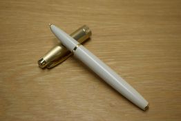 A Parker 100 converter fill fountain pen in Honey White with a Gold cap