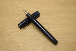 A Parker Duofold Junior button fill fountain pen in Blue and Black marble with two narrow cap