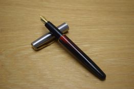 A Parker Frontier converter fill fountain pen in Red and Black with stainless steel cap with gold