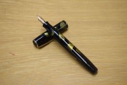 A Parker Duofold Deluxe Challenger Standard button fill fountain pen in Green and Black marble