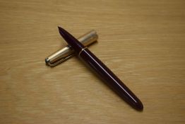 A Parker 51 aerometric fill fountain pen in Burgundy with a Rolled Gold cap