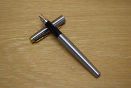 A Parker 75 Flighter cartridge fill fountain pen with gold trim having Parker 14K Point USA nib