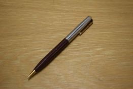 A Parker 51 propelling pencil in Cordovan Brown with lustraloy cap with jewellers band and gold fill