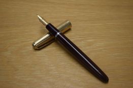 A Parker VP button fill fountain pen in Danish Brown with a Rolled Gold cap having a Parker 14CT