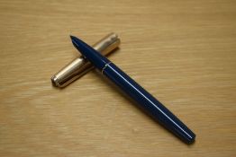 A Parker 51 aerometric fill fountain pen in Teal with Rolled Gold cap