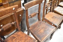 A 19th Century harlequin set of three rail back dining chairs having solid seats and turned legs