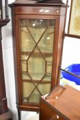 An Edwardian mahogany corner display having astral glazed door, height approx. 166cm