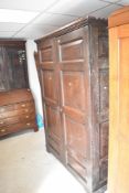 A period oak hall robe having panelled doors , dimensions approx. H212cm W144cm D44cm