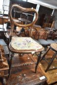 A Victorian stained frame (simulated rosewood) balloon back bedroom chair