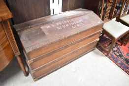 A vintage dome top travel trunk having scumbled decoration and painted name to top, width approx.