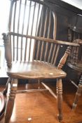 A 19th Century Windsor style kitchen armchair