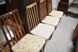 A set of four G plan rail back dining chairs
