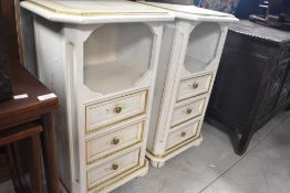 A pair of decorative bedside cabinets having crackled style decoration with foliate detail