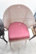 A Lloyd Loom tub chair