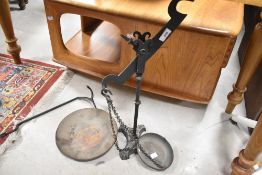 A Victorian wrought iron and brass balance scale