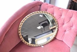 A gilt frame oval wall mirror, approx. 55 x 45cm