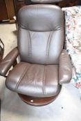A dark brown leather Stressless easy chair and footstool