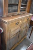 A late Victorian or Edwardian light mahogany bookcase having cupboard under, width approx. 107cm