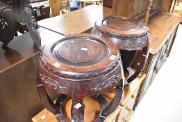 A pair of Oriental hardwood occasional tables