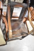 A period oak solid seat carver chair