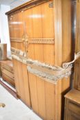 A vintage Old Charm style three piece bedroom suite in golden oak, comprising wardrobe, dressing
