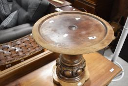 A 19th Century and later composite occasional table made from table column, diameter approx. 42cm