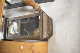 A 1920s/1930s oak cased wall clock