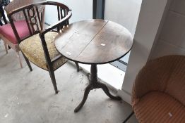 A 19th Century occasional table having circular top, turned column and triple splay legs, diameter
