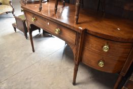 A Regency mahogany sideboard, having central drawer flanked by cupboards, width approx. 120cm