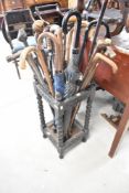 A vintage stick stand and contents