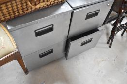 Two metal two drawer filing cabinets