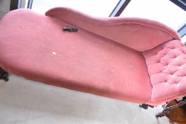 A Victorian chaise longue having later pink dralon upholstery