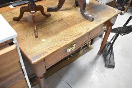 An early 20th Century oak desk having two frieze drawers, approx. 122 x 75cm