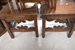 A pair of 17th or 18th Century and later Italian style solid seat hall chairs having typical