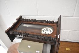 A 19th Century mahogany cased wall clock , roman numeral dial