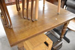 A Victorian oak drawer lead dining table on turned legs, approx width. 122cm